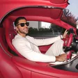 Manjeet Singh Sangha off-duty in a sports car — one of the tangible results of DSU Platinum